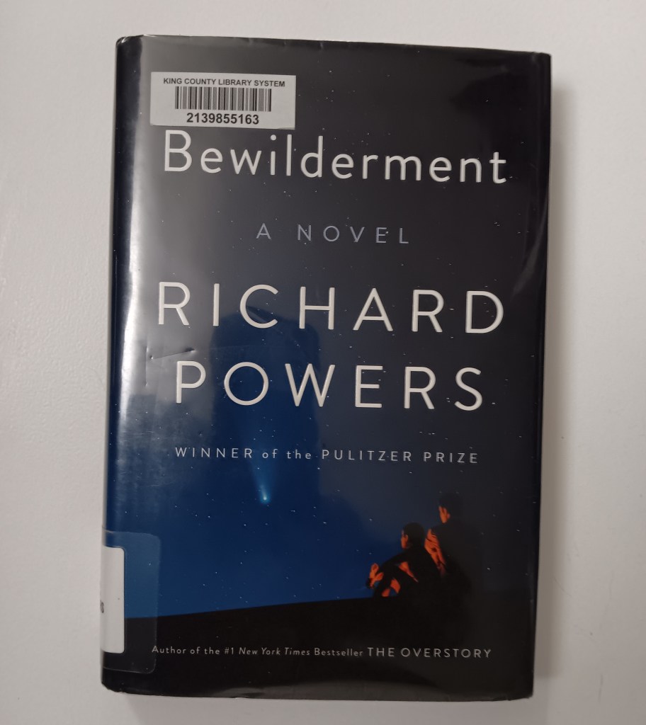 Cover of Bewilderment by Richard Powers, with a father and son sitting in the dark looking out at a star-filled sky